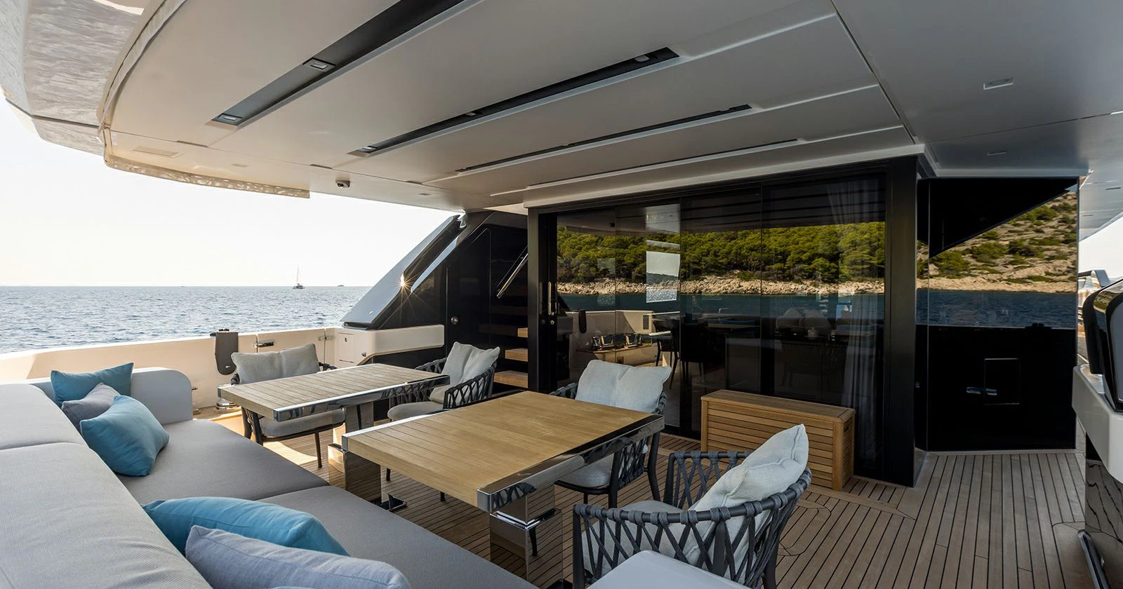 a room with a table and chairs aboard JICJ Yacht for Sale