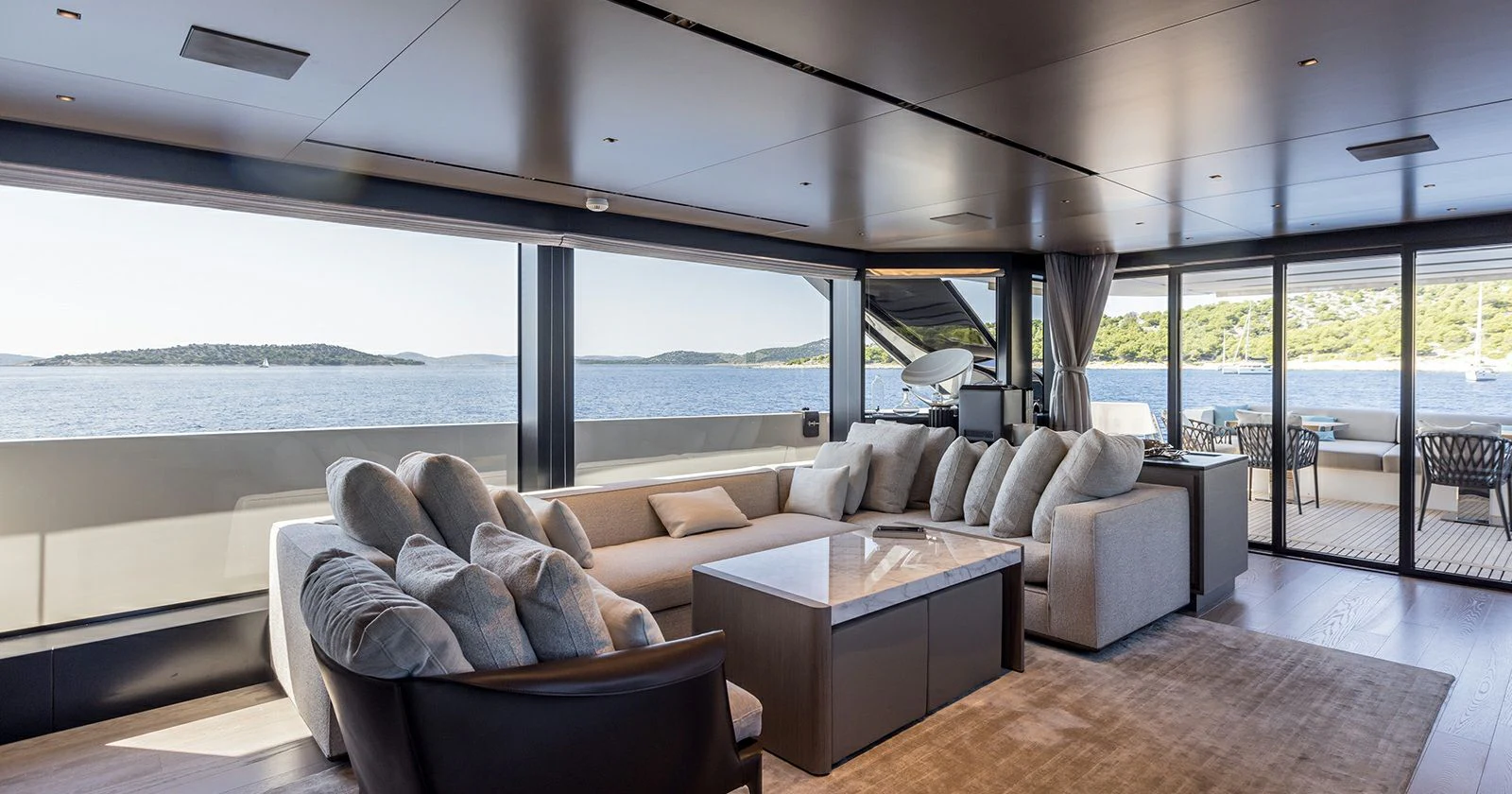 a living room with a large window aboard JICJ Yacht for Sale