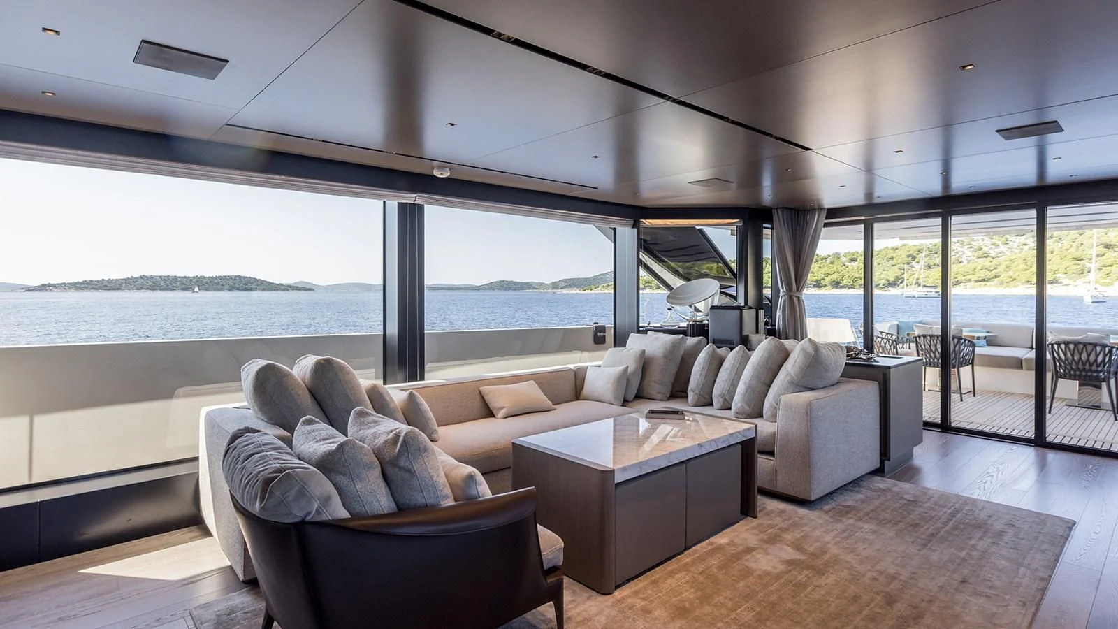 a living room with a large window aboard JICJ Yacht for Sale