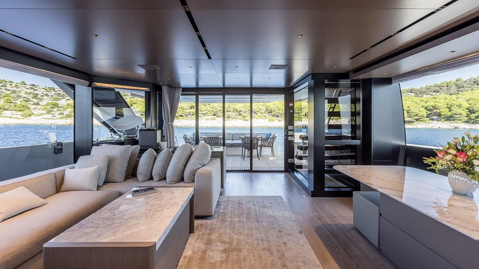 a living room with a large window aboard JICJ Yacht for Sale