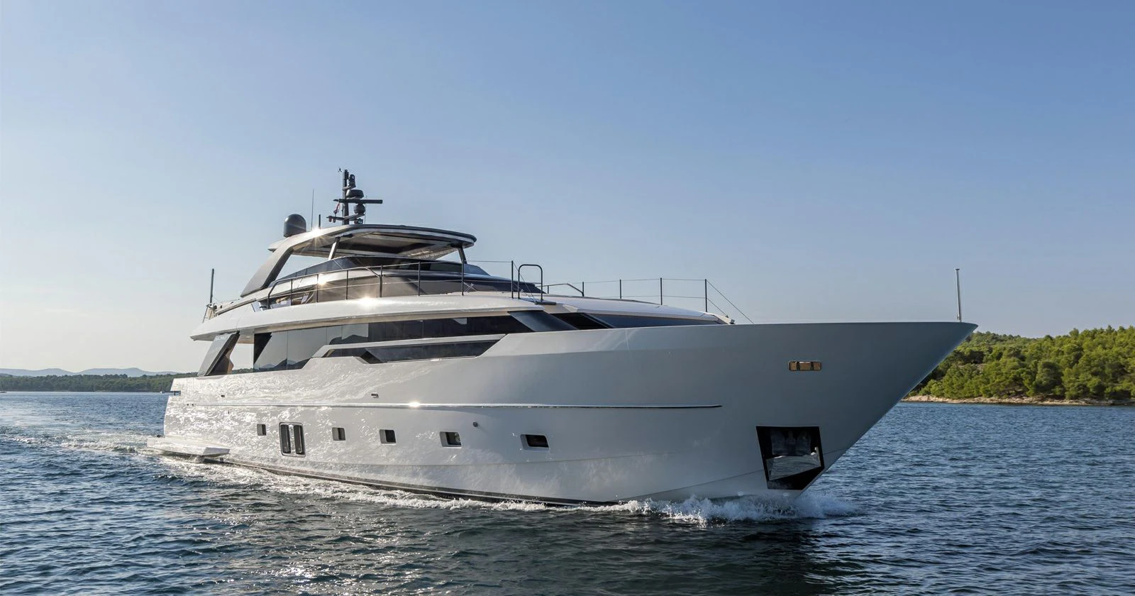 a white yacht on the water aboard JICJ Yacht for Sale