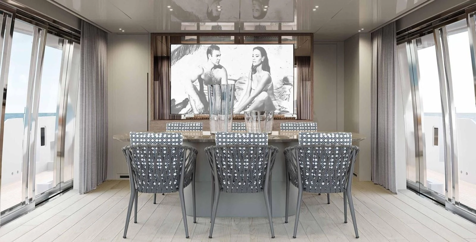 a room with chairs and a table aboard JICJ Yacht for Sale