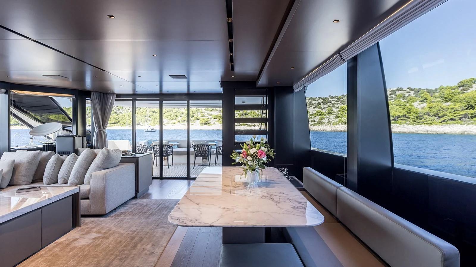 a living room with a large window aboard JICJ Yacht for Sale