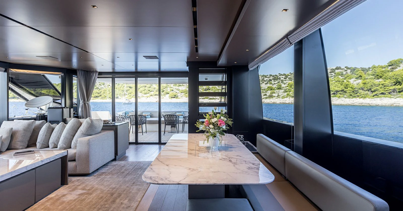 a living room with a large window aboard JICJ Yacht for Sale