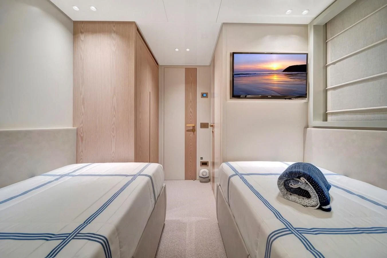 a hospital room with a bed and a television aboard JICJ Yacht for Sale