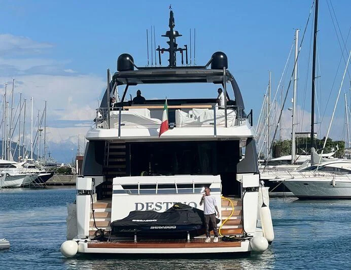 a boat with a couple of people on it aboard JICJ Yacht for Sale