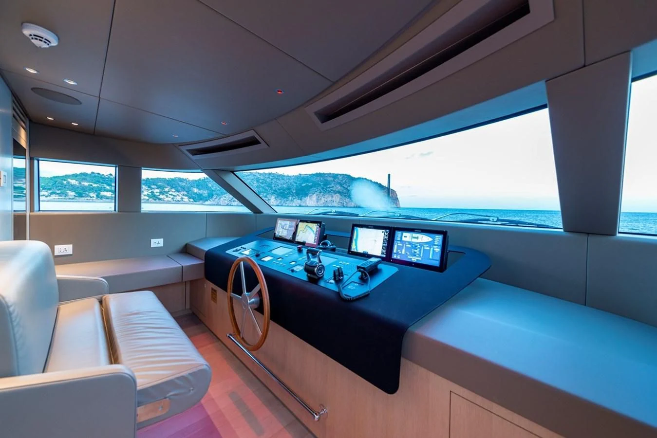 inside of a vehicle with a pool table and chairs aboard JICJ Yacht for Sale