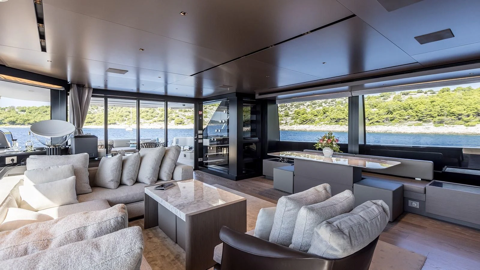 a living room with a large window aboard JICJ Yacht for Sale
