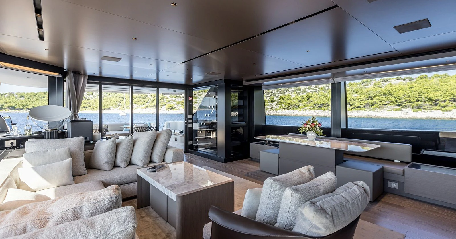 a living room with a large window aboard JICJ Yacht for Sale