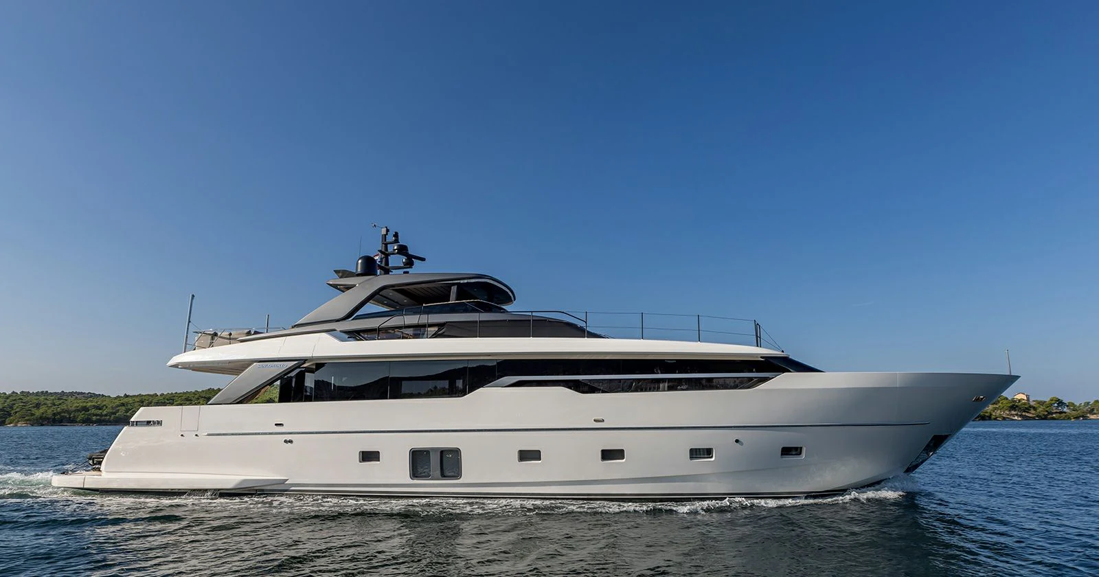 a large white boat on the water aboard JICJ Yacht for Sale