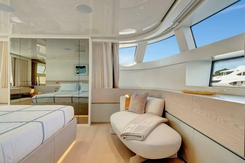 a room with a bed and a window aboard JICJ Yacht for Sale