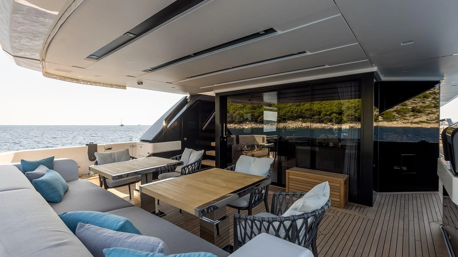 a room with a table and chairs aboard JICJ Yacht for Sale