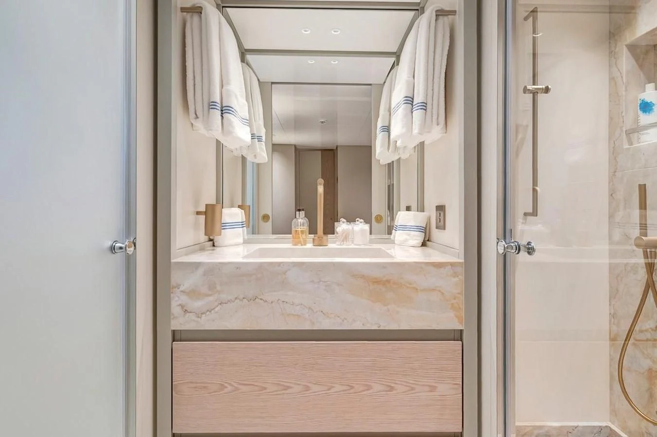 a bathroom with a large mirror aboard JICJ Yacht for Sale