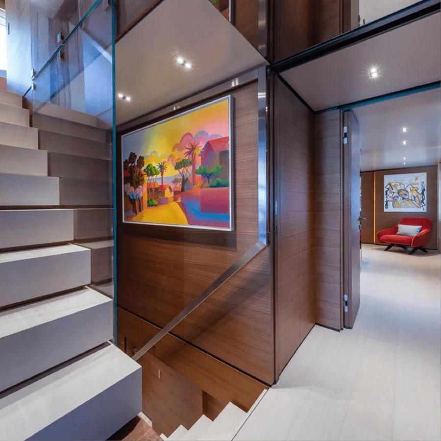 a room with a staircase and a glass door aboard MIA CA Yacht for Sale