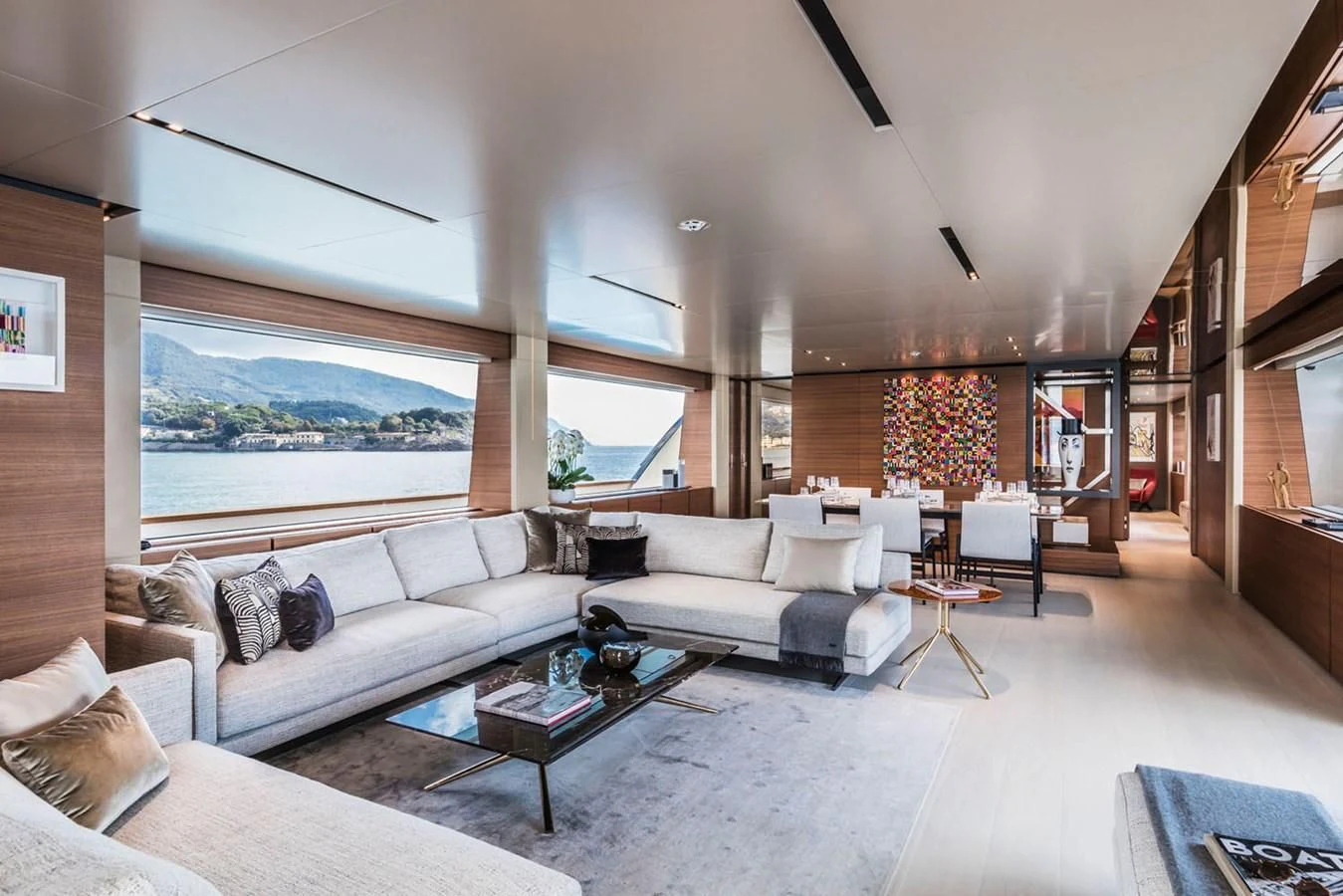 a living room with a large window aboard MIA CA Yacht for Sale