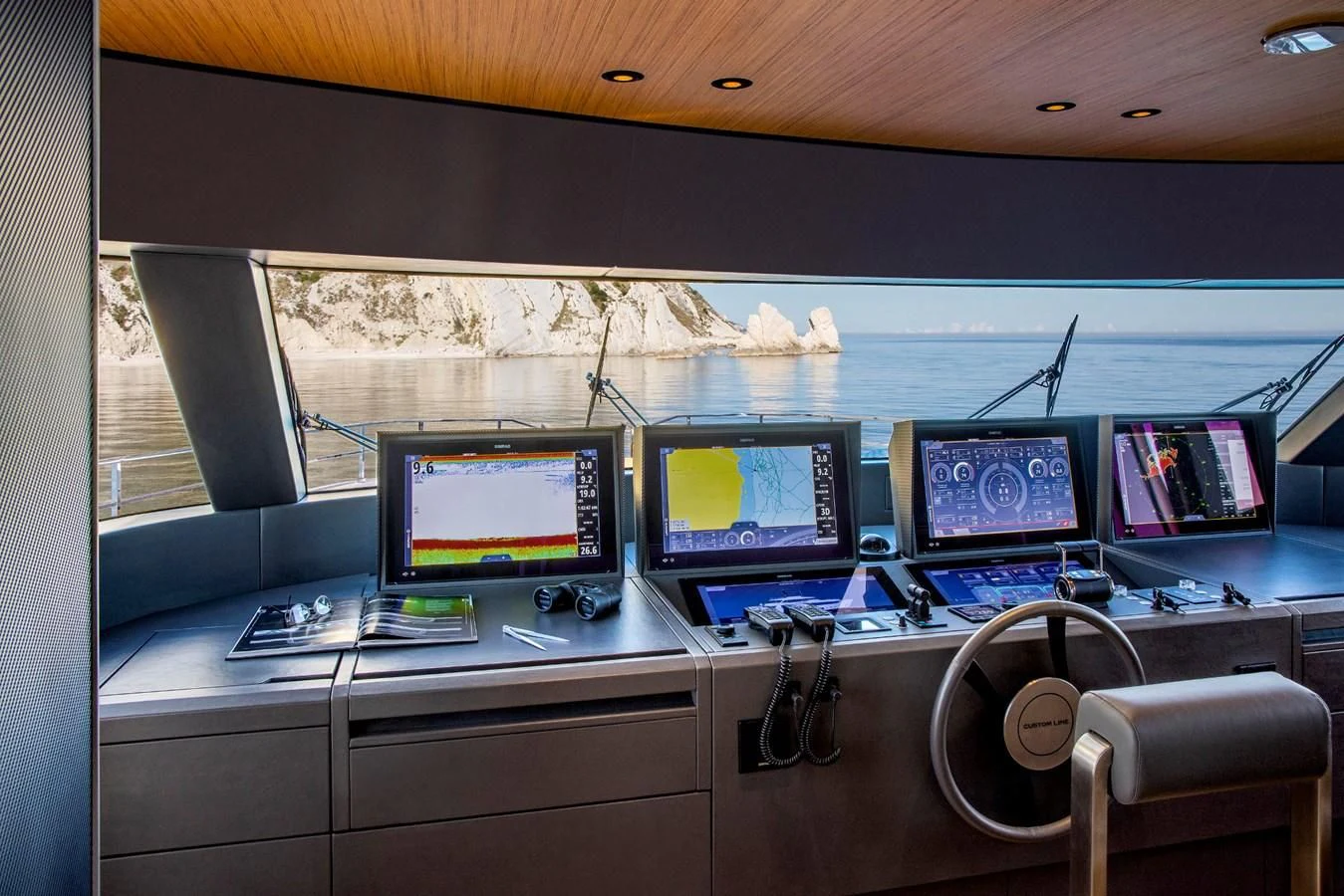 a row of computer screens on a desk aboard MIA CA Yacht for Sale