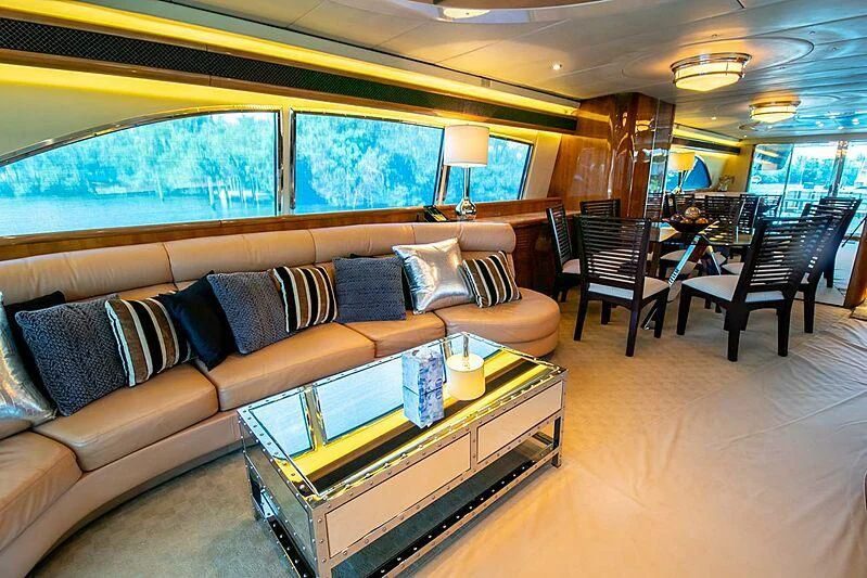 a living room with a couch and a coffee table aboard ALMAR Yacht for Sale