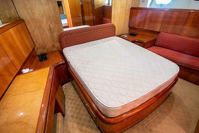 a bed in a room aboard ALMAR Yacht for Sale