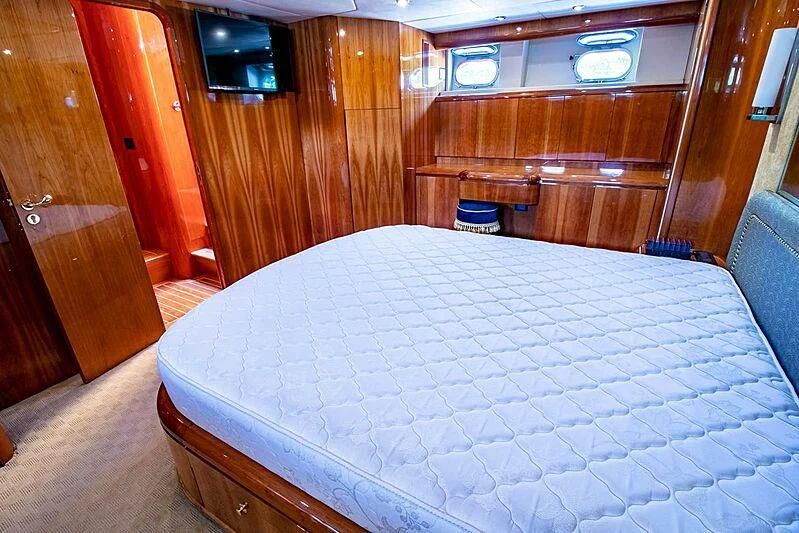 a bed in a room aboard ALMAR Yacht for Sale