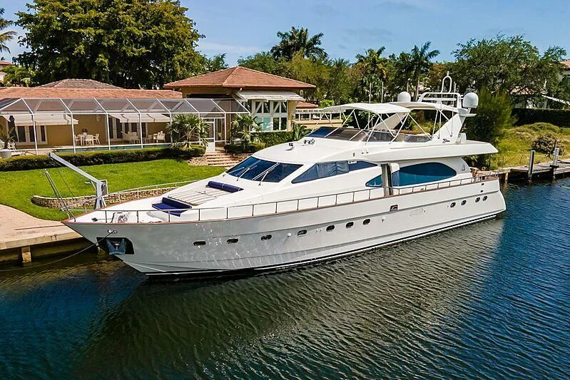 a white yacht docked at a pier aboard ALMAR Yacht for Sale
