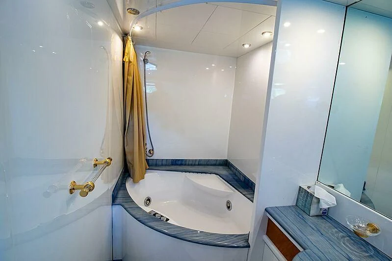 a bathtub in a bathroom aboard ALMAR Yacht for Sale