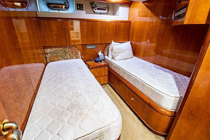 a couple of beds in a room aboard ALMAR Yacht for Sale