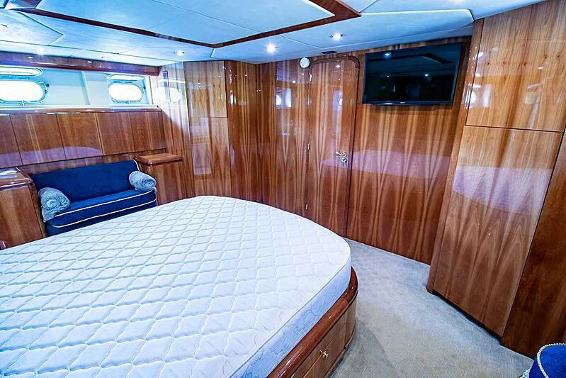 a room with a bed and a couch aboard ALMAR Yacht for Sale