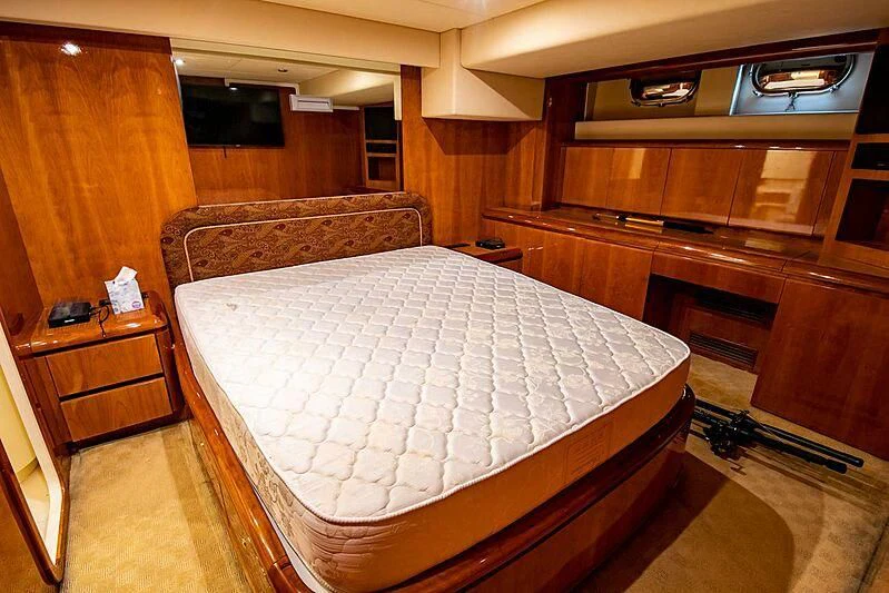 a bed in a room aboard ALMAR Yacht for Sale