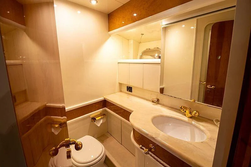 a bathroom with a sink and a toilet aboard ALMAR Yacht for Sale