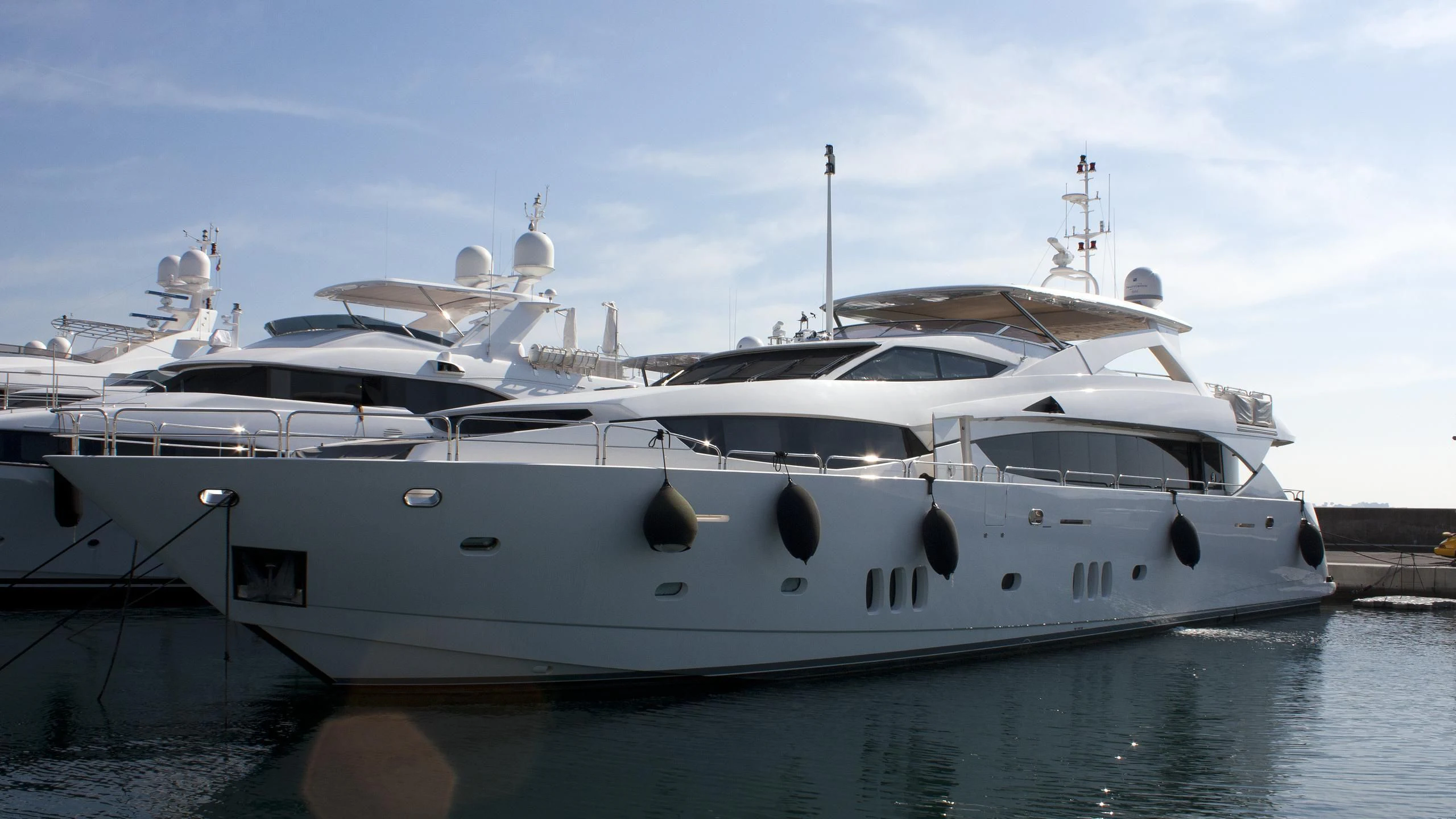 a white yacht docked aboard QUO VADIS Yacht for Sale
