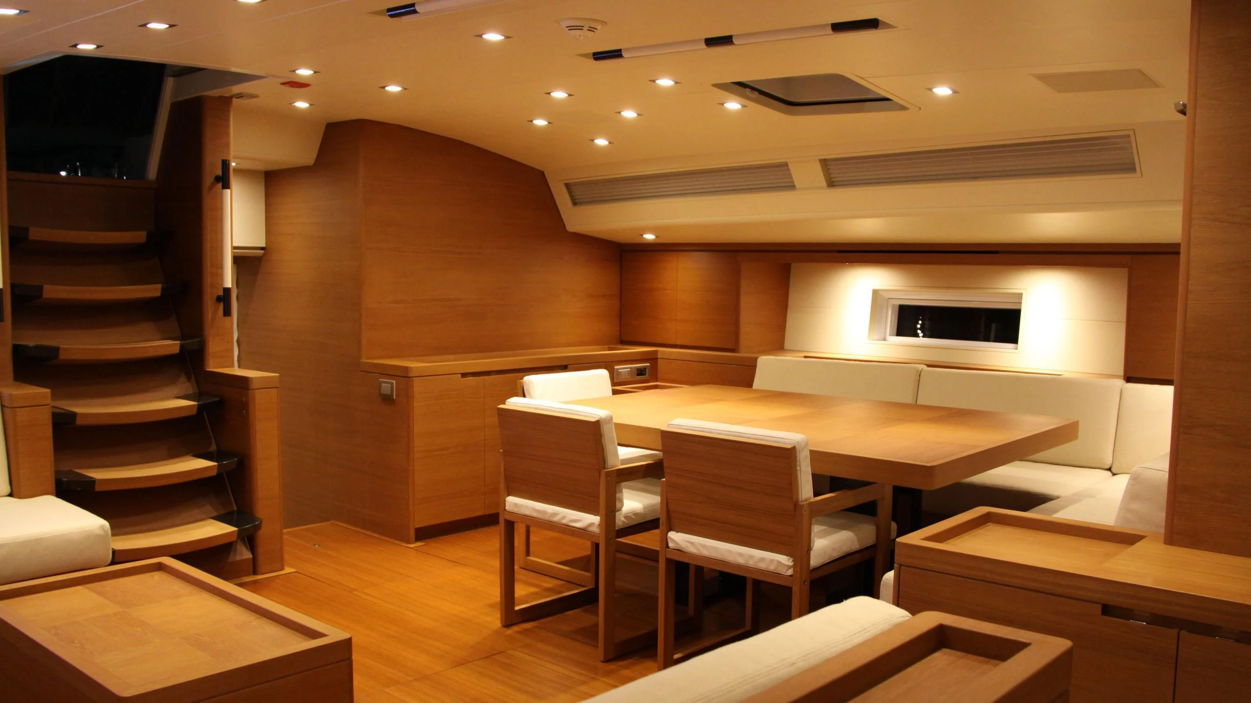 a room with a table and chairs aboard GRILLO PARLANTE Yacht for Sale