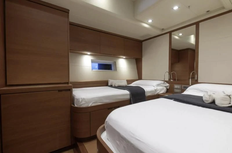 a room with two beds aboard GRILLO PARLANTE Yacht for Sale