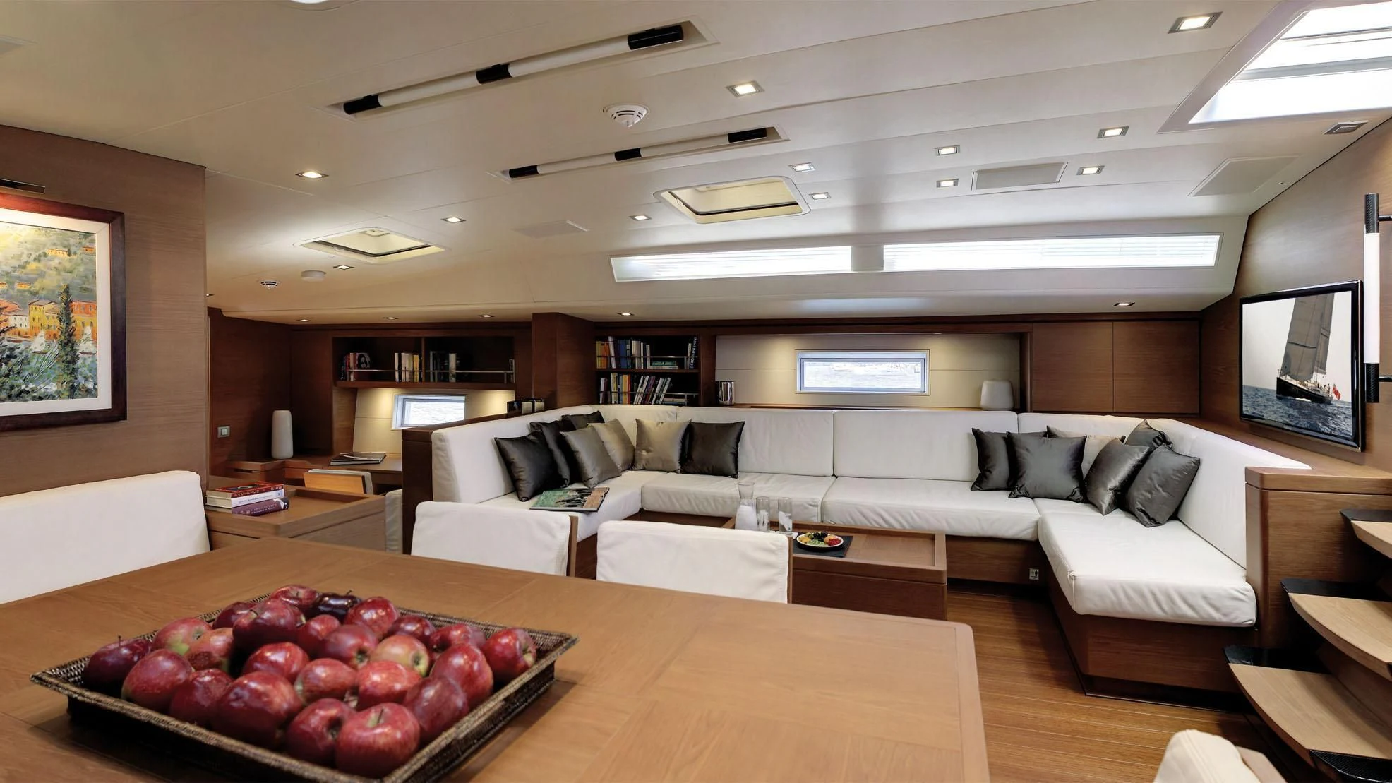 a living room with a couch and a table aboard GRILLO PARLANTE Yacht for Sale