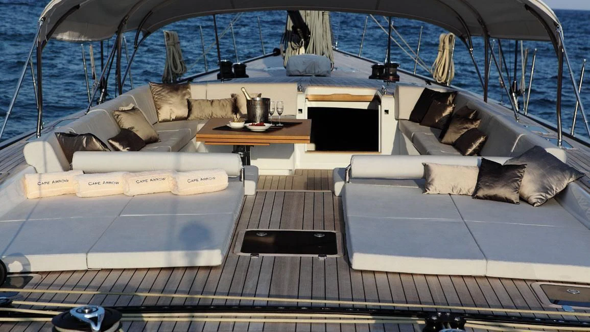 a boat with a bed and a table on it aboard GRILLO PARLANTE Yacht for Sale