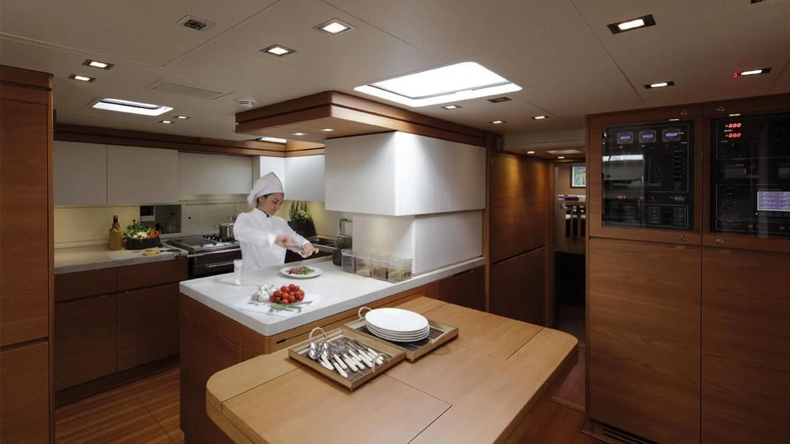 a chef in a kitchen aboard GRILLO PARLANTE Yacht for Sale
