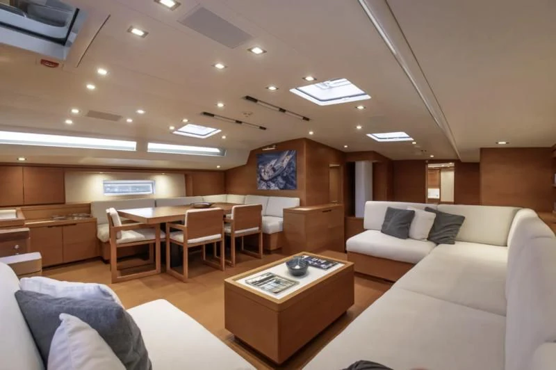 a living room with a couch and a coffee table aboard GRILLO PARLANTE Yacht for Sale