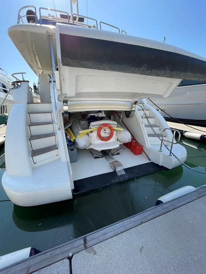 a white boat on a dock aboard AZIMUT 85 ULTIMATE Yacht for Sale