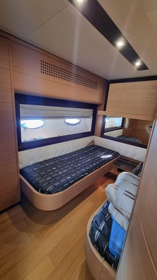 a room with a large bed aboard GUSS 97 Yacht for Sale
