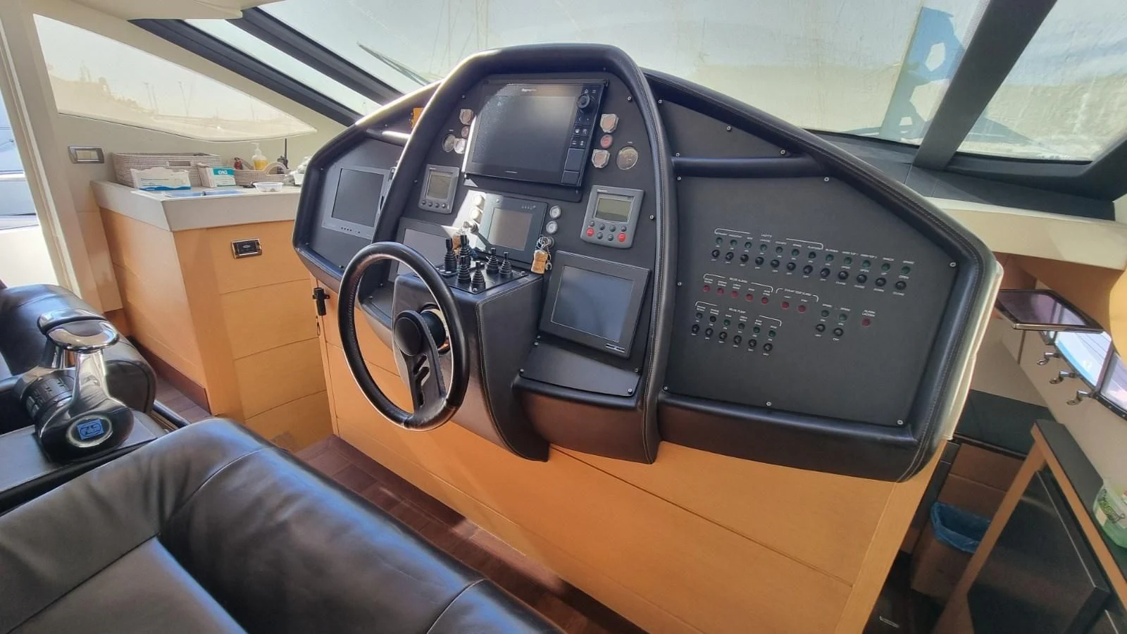 a black machine on a wooden desk aboard GUSS 97 Yacht for Sale