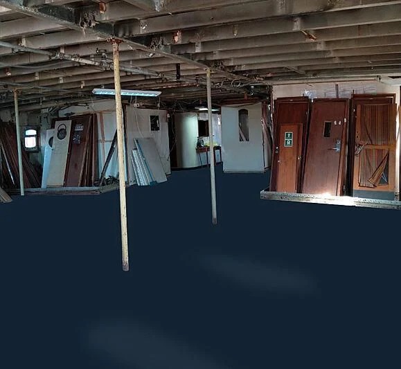a building with a blue wall aboard EVANGELIYA Yacht for Sale