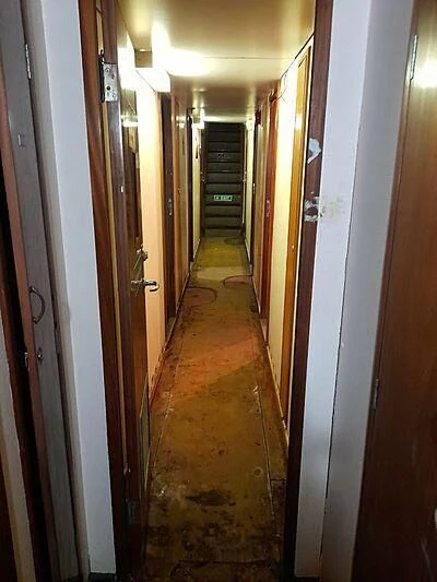a hallway with a door aboard EVANGELIYA Yacht for Sale