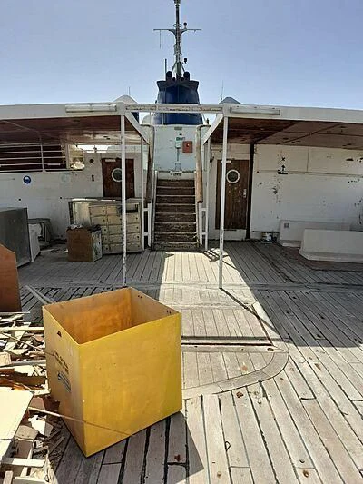 a large metal box on a wooden deck aboard EVANGELIYA Yacht for Sale