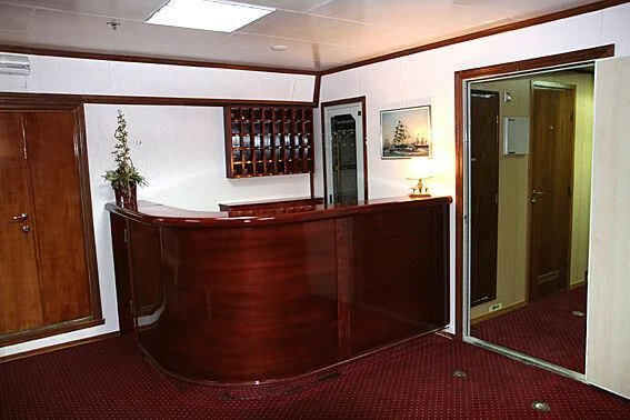 a room with a desk and a chair aboard EVANGELIYA Yacht for Sale