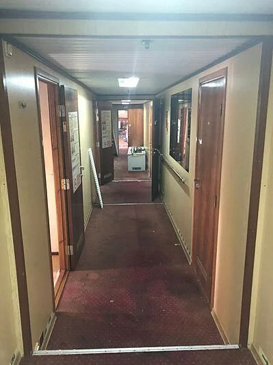 a hallway with doors aboard EVANGELIYA Yacht for Sale