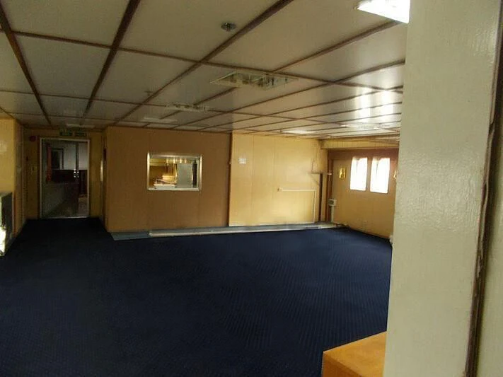 a room with a blue carpet aboard EVANGELIYA Yacht for Sale