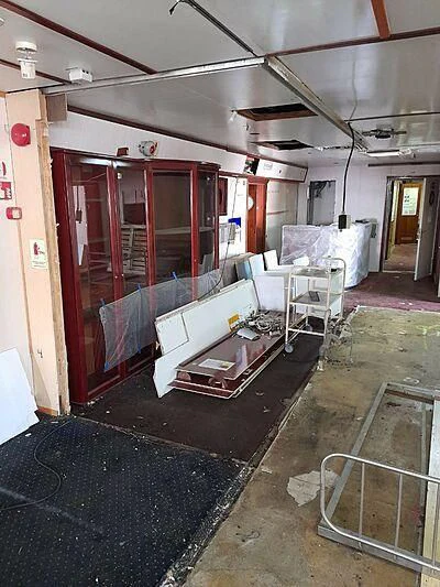 a room with a bed and a desk aboard EVANGELIYA Yacht for Sale