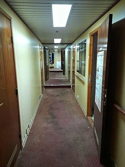 a hallway with doors aboard EVANGELIYA Yacht for Sale