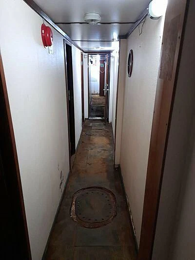 a hallway with a round rug aboard EVANGELIYA Yacht for Sale
