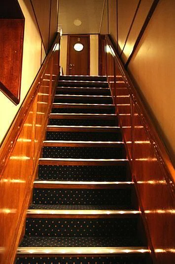 a set of stairs in a building aboard EVANGELIYA Yacht for Sale