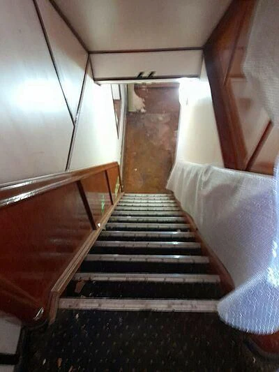 a staircase with a stone railing aboard EVANGELIYA Yacht for Sale